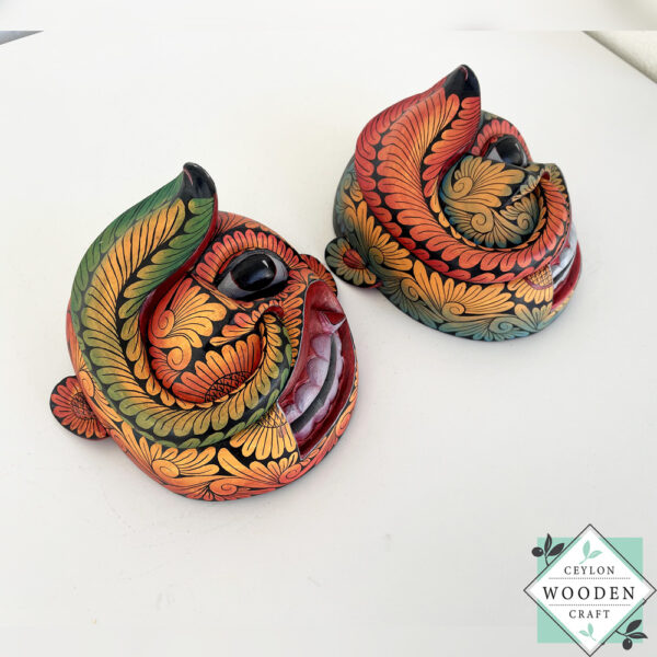 Inspired by Sri Lanka’s traditional Bihiri Sanni masks, this hand-carved and hand-painted wooden snake mask brings boho charm and cultural depth to any wall space.