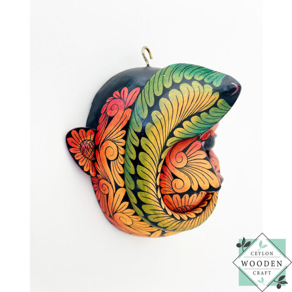 Inspired by Sri Lanka’s traditional Bihiri Sanni masks, this hand-carved and hand-painted wooden snake mask brings boho charm and cultural depth to any wall space.