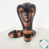 Hand-carved mahogany snake statue symbolizing rebirth and immortality. A unique, eco-friendly decor piece for boho, spiritual, or witchy spaces.