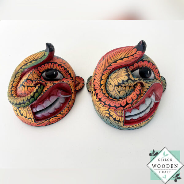 Inspired by Sri Lanka’s traditional Bihiri Sanni masks, this hand-carved and hand-painted wooden snake mask brings boho charm and cultural depth to any wall space.