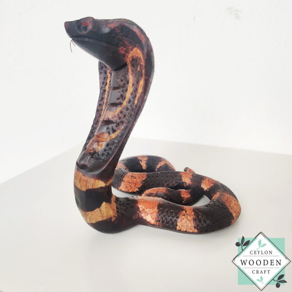 Hand-carved mahogany snake statue symbolizing rebirth and immortality. A unique, eco-friendly decor piece for boho, spiritual, or witchy spaces.