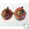 Inspired by Sri Lanka’s traditional Bihiri Sanni masks, this hand-carved and hand-painted wooden snake mask brings boho charm and cultural depth to any wall space.