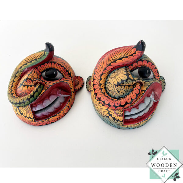 Inspired by Sri Lanka’s traditional Bihiri Sanni masks, this hand-carved and hand-painted wooden snake mask brings boho charm and cultural depth to any wall space.