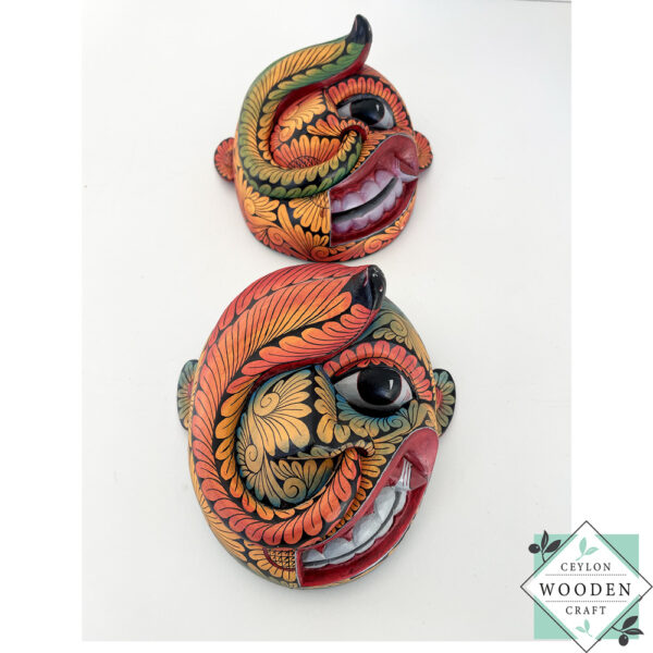 Inspired by Sri Lanka’s traditional Bihiri Sanni masks, this hand-carved and hand-painted wooden snake mask brings boho charm and cultural depth to any wall space.