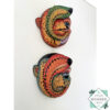 Inspired by Sri Lanka’s traditional Bihiri Sanni masks, this hand-carved and hand-painted wooden snake mask brings boho charm and cultural depth to any wall space.