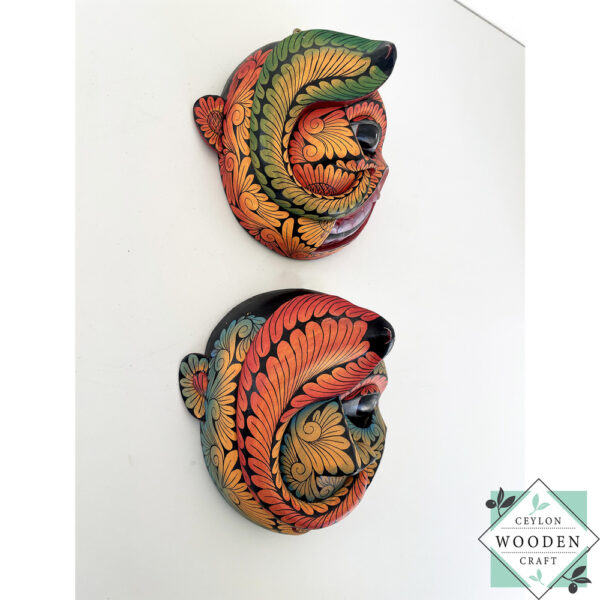 Inspired by Sri Lanka’s traditional Bihiri Sanni masks, this hand-carved and hand-painted wooden snake mask brings boho charm and cultural depth to any wall space.
