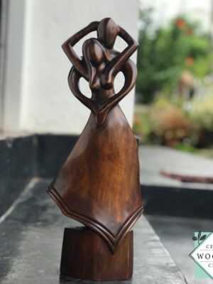 Hand-carved wooden lovers statue made from mahogany. A romantic anniversary gift with optional free engraving. Available in two sizes. 100% handmade.