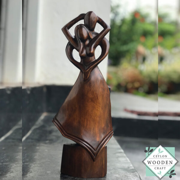 Hand-carved wooden lovers statue made from mahogany. A romantic anniversary gift with optional free engraving. Available in two sizes. 100% handmade.