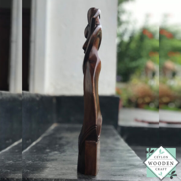 Hand-carved wooden lovers statue made from mahogany. A romantic anniversary gift with optional free engraving. Available in two sizes. 100% handmade.