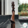 Hand-carved wooden lovers statue made from mahogany. A romantic anniversary gift with optional free engraving. Available in two sizes. 100% handmade.