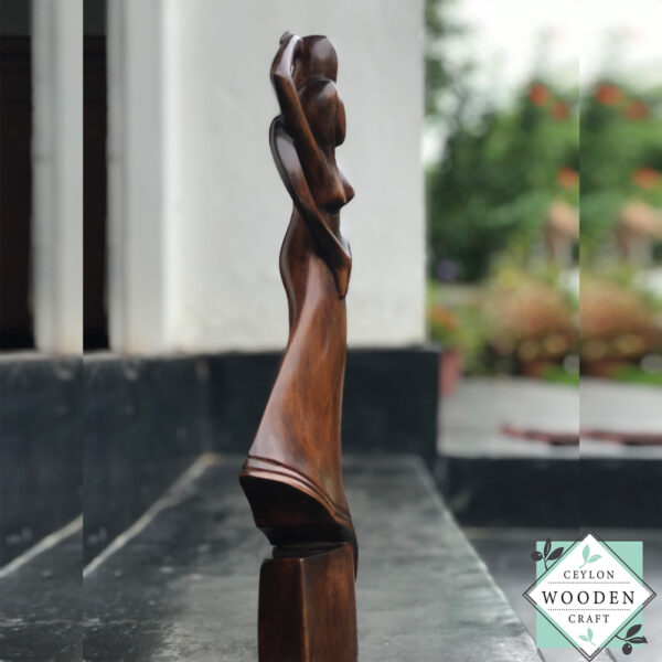Hand-carved wooden lovers statue made from mahogany. A romantic anniversary gift with optional free engraving. Available in two sizes. 100% handmade.