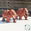 hand-carved coconut wood Set of two elephant figures with tusks. Handmade in Sri Lanka. Perfect for gifts, decor, or meaningful souvenirs.