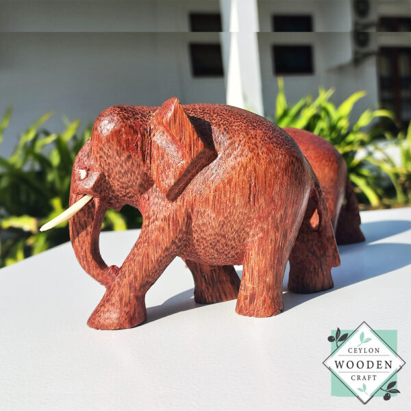 hand-carved coconut wood Set of two elephant figures with tusks. Handmade in Sri Lanka. Perfect for gifts, decor, or meaningful souvenirs.