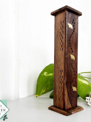 Handcrafted mahogany incense holder with hidden design. Holds up to 4 sticks. Ideal for meditation, aromatherapy, and elegant home decor.