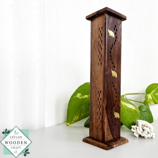 Handcrafted mahogany incense holder with hidden design. Holds up to 4 sticks. Ideal for meditation, aromatherapy, and elegant home decor.