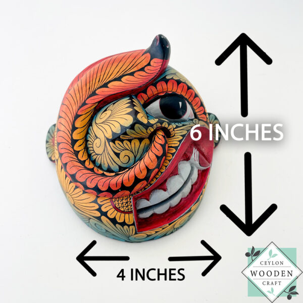 Inspired by Sri Lanka’s traditional Bihiri Sanni masks, this hand-carved and hand-painted wooden snake mask brings boho charm and cultural depth to any wall space.