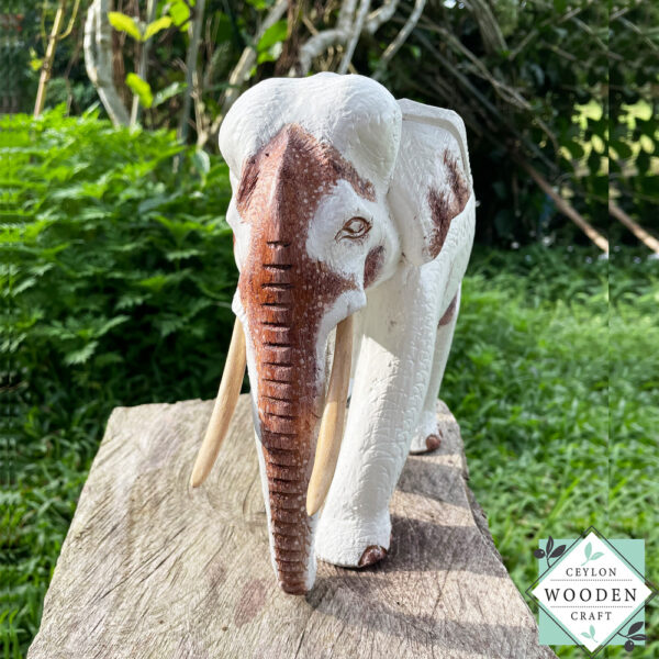 This hand-carved wooden white elephant sculpture features fine detailing and elegant tusks. A beautiful, eco-friendly decor piece and a meaningful gift for any occasion.