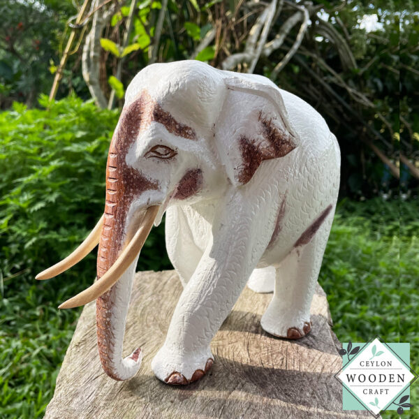This hand-carved wooden white elephant sculpture features fine detailing and elegant tusks. A beautiful, eco-friendly decor piece and a meaningful gift for any occasion.