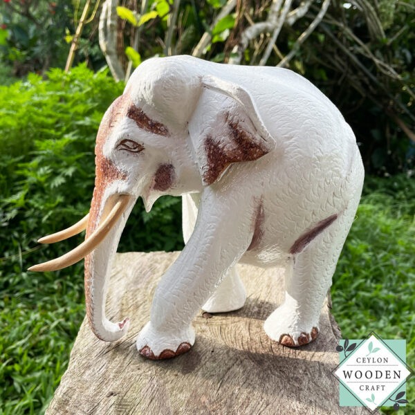This hand-carved wooden white elephant sculpture features fine detailing and elegant tusks. A beautiful, eco-friendly decor piece and a meaningful gift for any occasion.