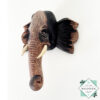 Hand-carved wooden elephant face sculpture with tusks. Made from mahogany wood. A symbol of luck and wisdom. Perfect for home decor or gifting.