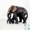Hand-carved mahogany elephant mother and baby sculpture. Symbolizes love, luck, and strength. A perfect handmade gift or decorative accent.
