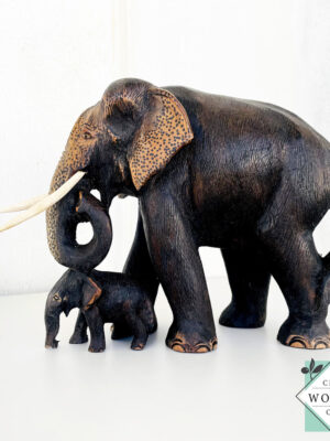 Hand-carved mahogany elephant mother and baby sculpture. Symbolizes love, luck, and strength. A perfect handmade gift or decorative accent.