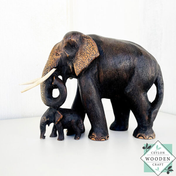 Hand-carved mahogany elephant mother and baby sculpture. Symbolizes love, luck, and strength. A perfect handmade gift or decorative accent.
