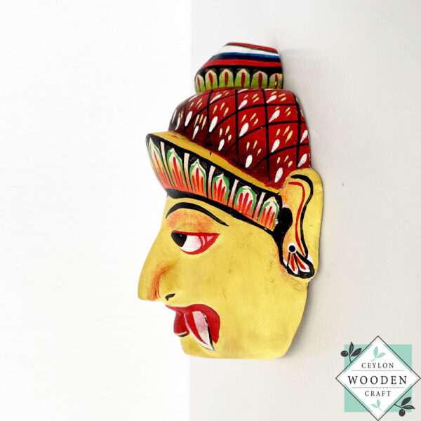Authentic Ceylon Sanni mask - handcrafted yellow wooden cultural wall decor from Sri Lanka. Traditional Dewa Sanni healing mask by skilled artisans. Collectible art.