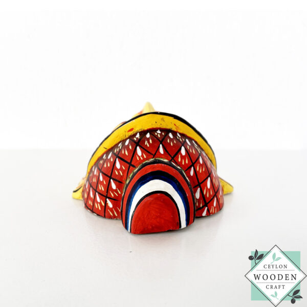 Authentic Ceylon Sanni mask - handcrafted yellow wooden cultural wall decor from Sri Lanka. Traditional Dewa Sanni healing mask by skilled artisans. Collectible art.