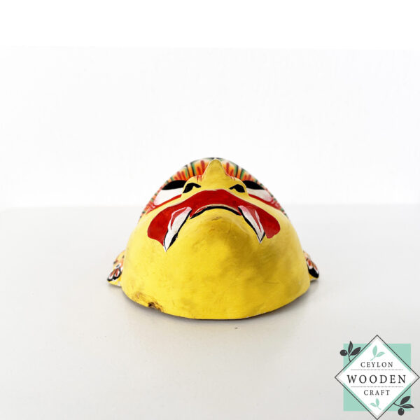 Authentic Ceylon Sanni mask - handcrafted yellow wooden cultural wall decor from Sri Lanka. Traditional Dewa Sanni healing mask by skilled artisans. Collectible art.