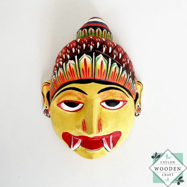 Authentic Ceylon Sanni mask - handcrafted yellow wooden cultural wall decor from Sri Lanka. Traditional Dewa Sanni healing mask by skilled artisans. Collectible art.