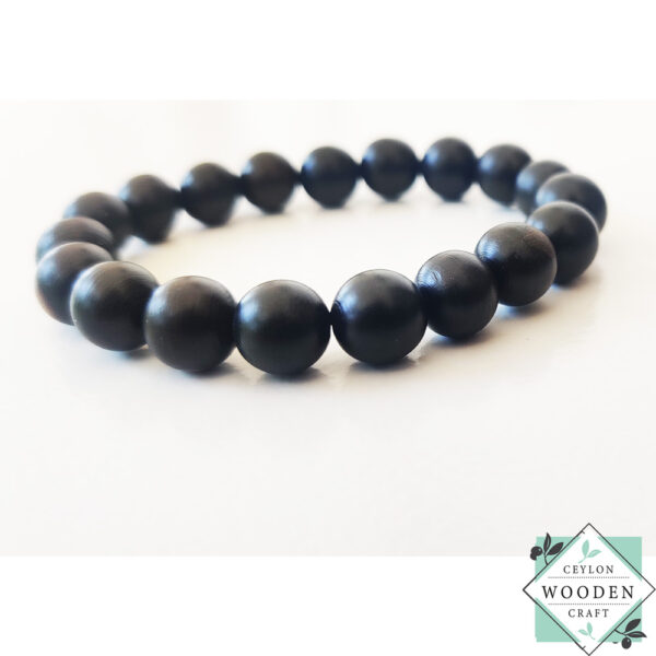 Handcrafted ebony wood bracelet with natural black finish. Premium wooden bangle for boho style & meditation. 3.5" diameter fits all sizes. Eco-friendly jewelry.