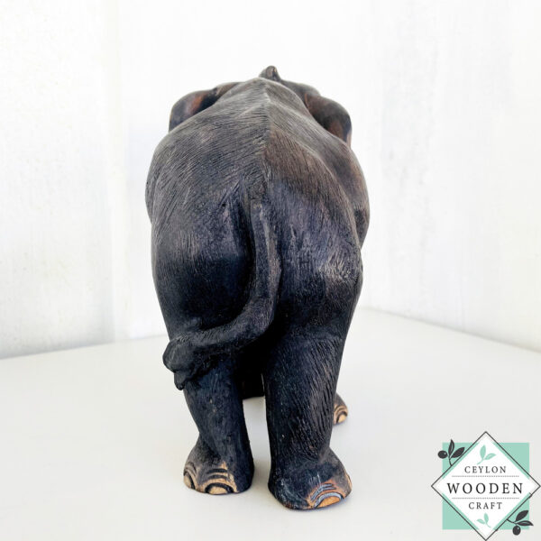 This hand-carved mahogany elephant mother with baby sculpture symbolizes love, protection, and good fortune—perfect for heartfelt gifting or home decor.