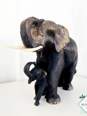 This hand-carved mahogany elephant mother with baby sculpture symbolizes love, protection, and good fortune—perfect for heartfelt gifting or home decor.
