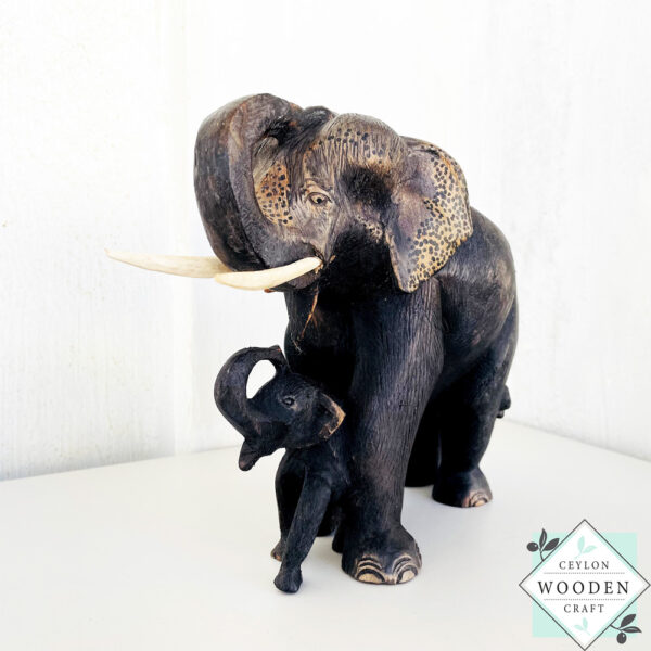 This hand-carved mahogany elephant mother with baby sculpture symbolizes love, protection, and good fortune—perfect for heartfelt gifting or home decor.